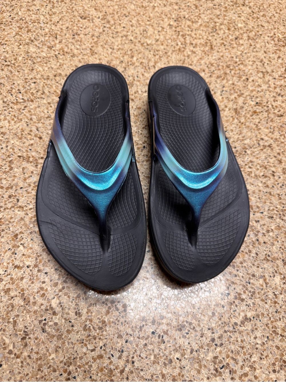 OOFOS Black Recovery Flip Flops with Iridescent Teal Strap